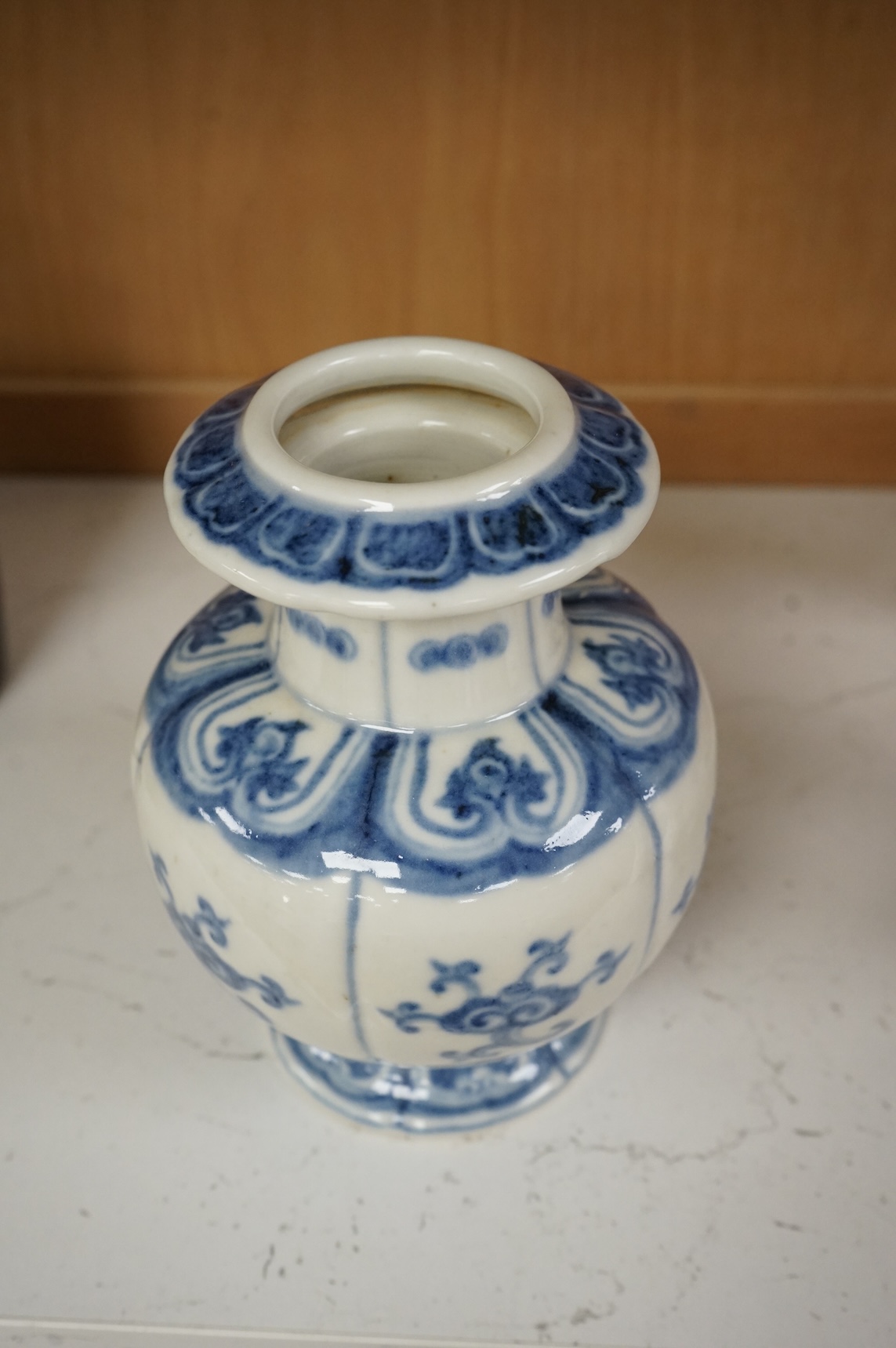 A Chinese blue and white pomegranate shaped vase, 18cm high